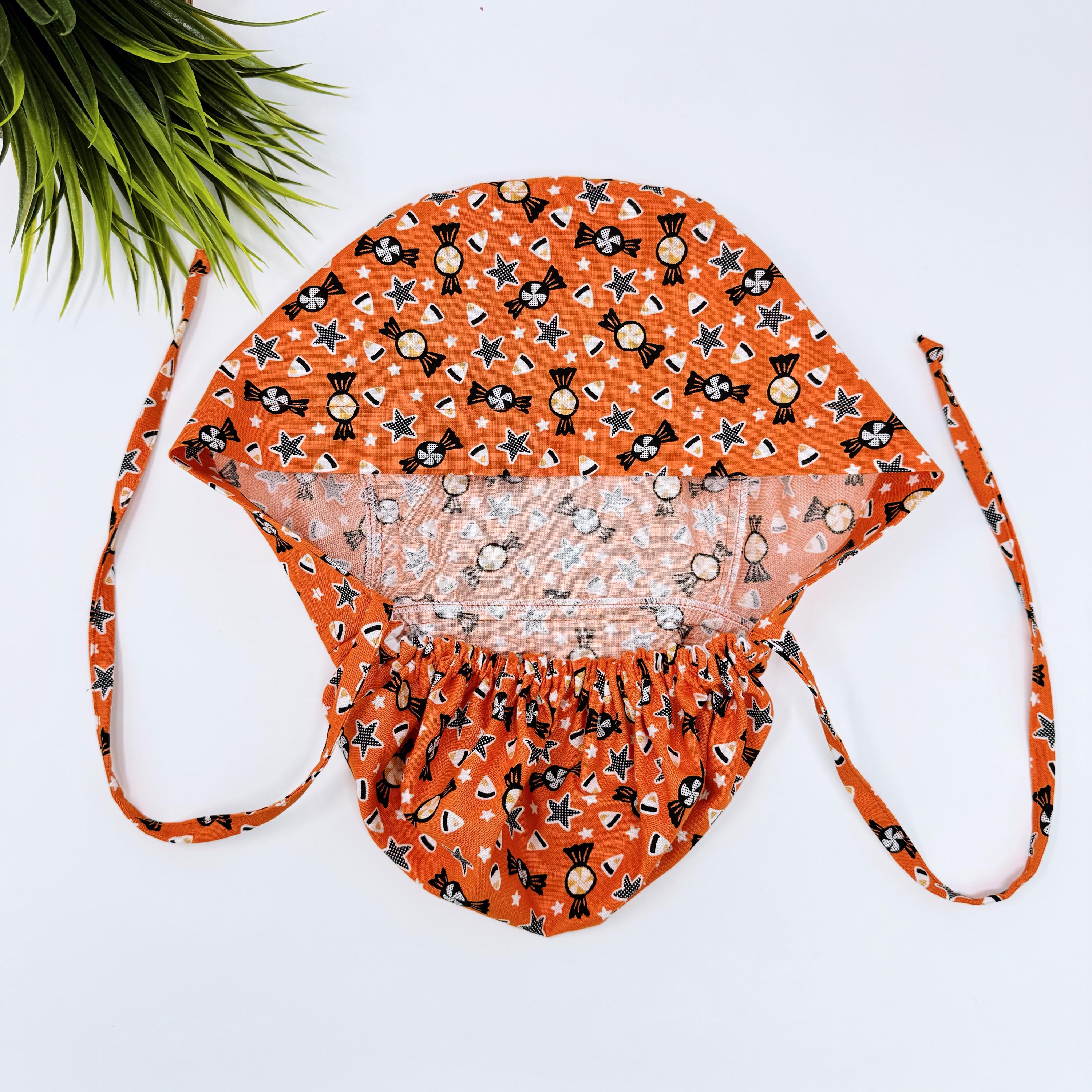 Candy corn Ponytail scrub cap for women with satin lined option by Paradise Caps.