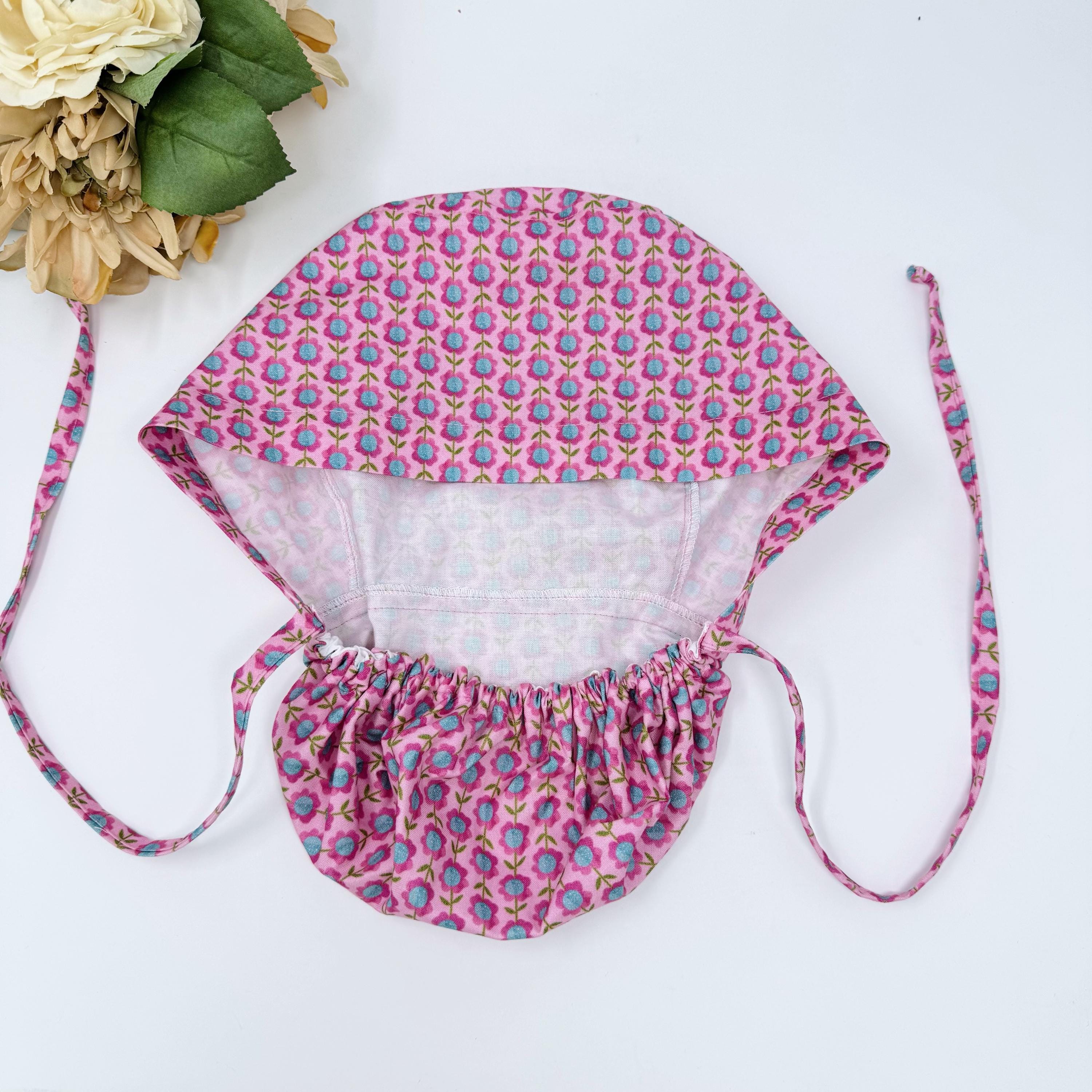 Floral Ponytail scrub cap for women. Pink Scrub hat for women with satin lined option by Paradise Caps.