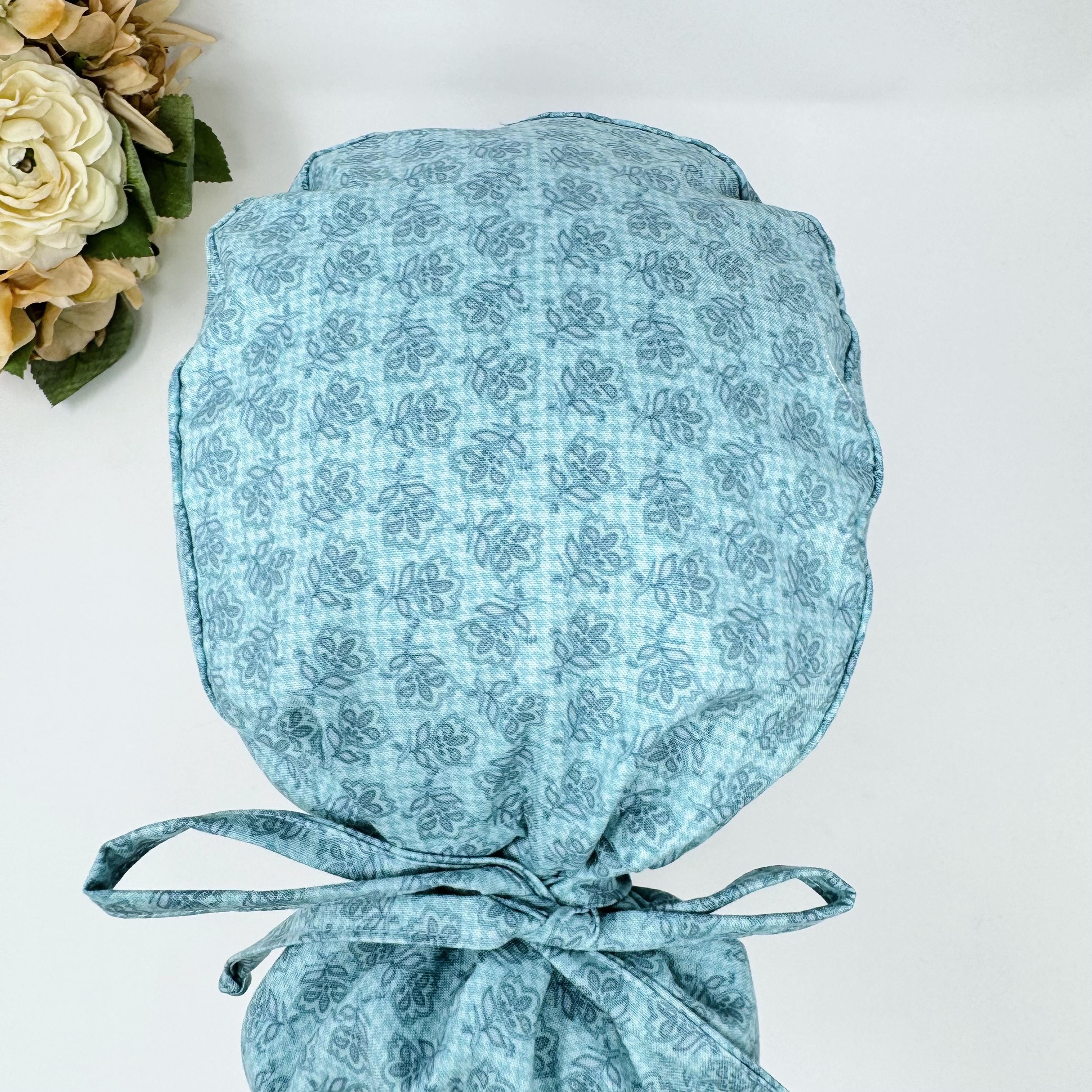Floral Ponytail scrub cap for women. Pink Scrub hat for women with satin lined option by Paradise Caps.