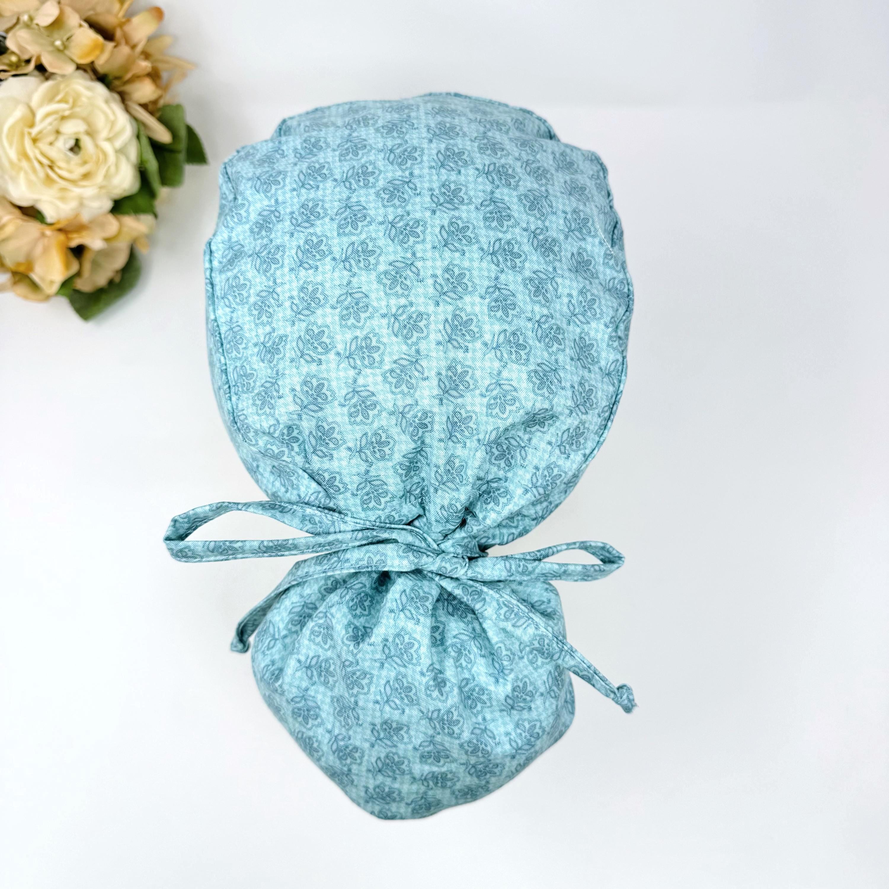 Floral Ponytail scrub cap for women. Pink Scrub hat for women with satin lined option by Paradise Caps.