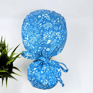 Calm Blue Ponytail scrub cap for women with satin lined option by Paradise Caps.