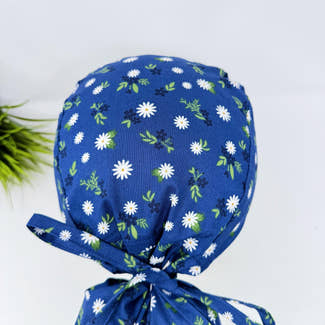 Ponytail scrub cap for women. Navy Daisy surgical hat for women with satin lined option by Paradise Caps.