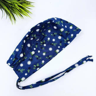 Navy Daisy Skull tie-back style surgical scrub cap by Paradise Caps.