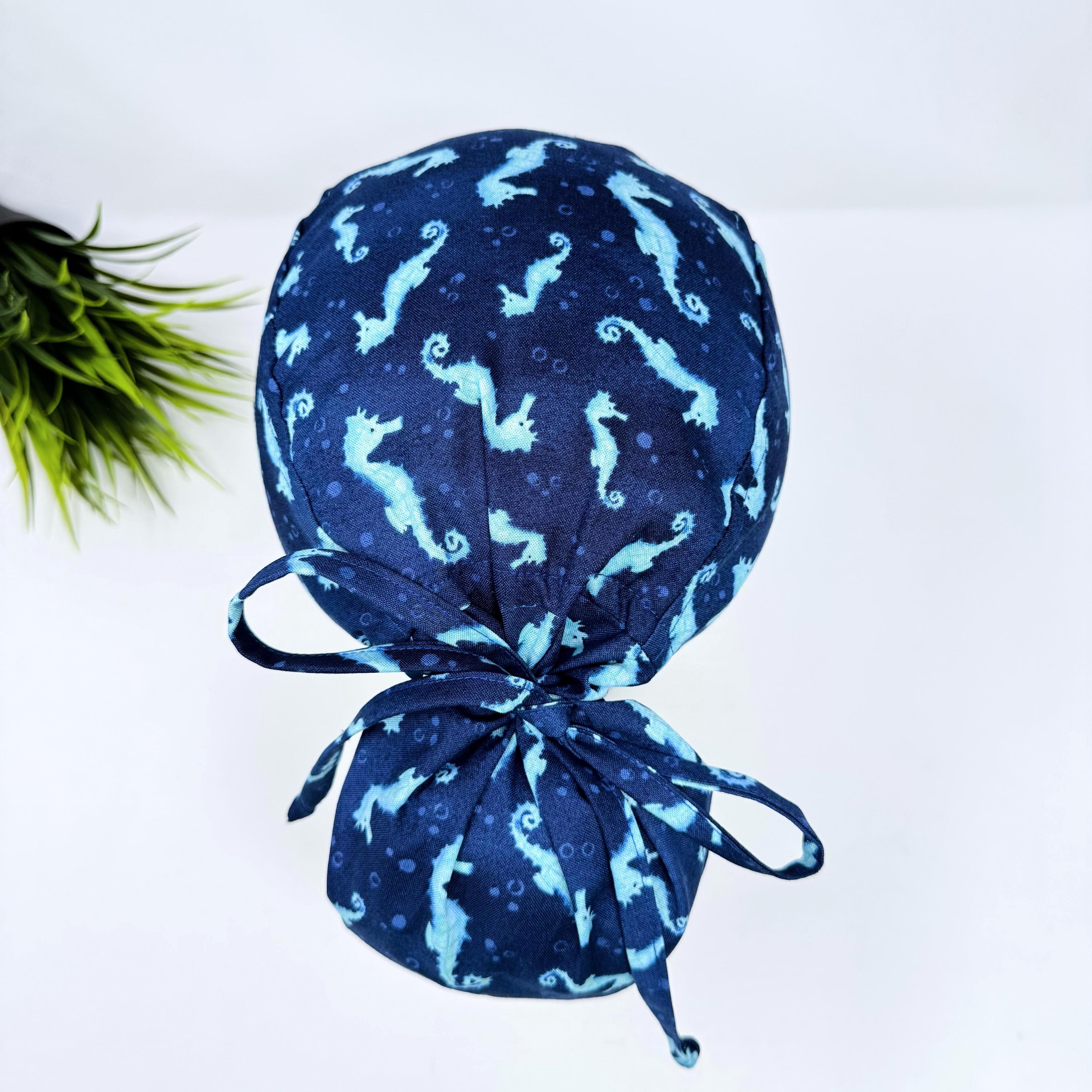Ponytail scrub cap women. Ocean Seahorse Print Satin Lined option Ponytail scrub hat. Scrub caps for women by Paradise Caps.