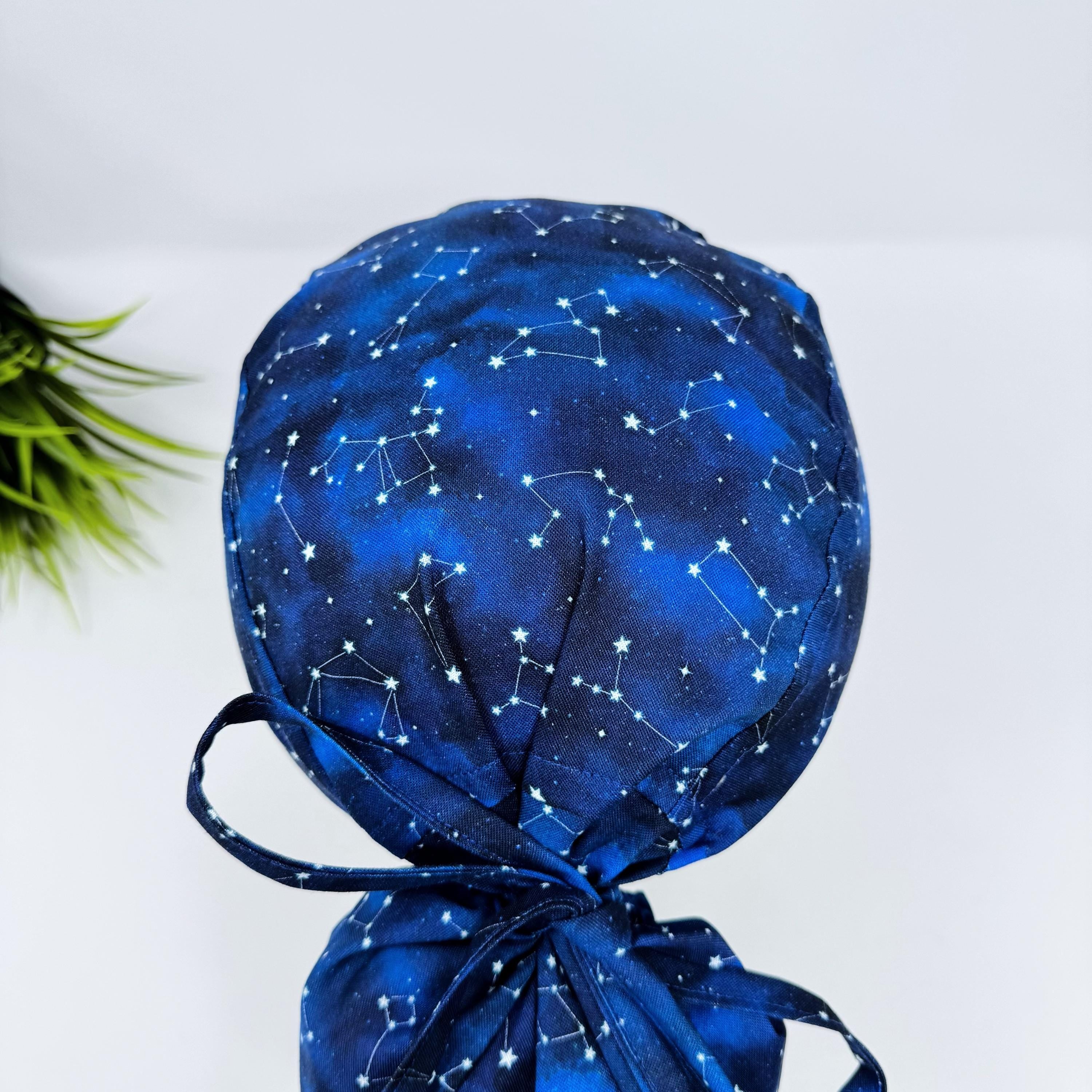 Ponytail scrub cap with satin lined option. Constellation Blue Scrub hat for women by Paradise Caps.