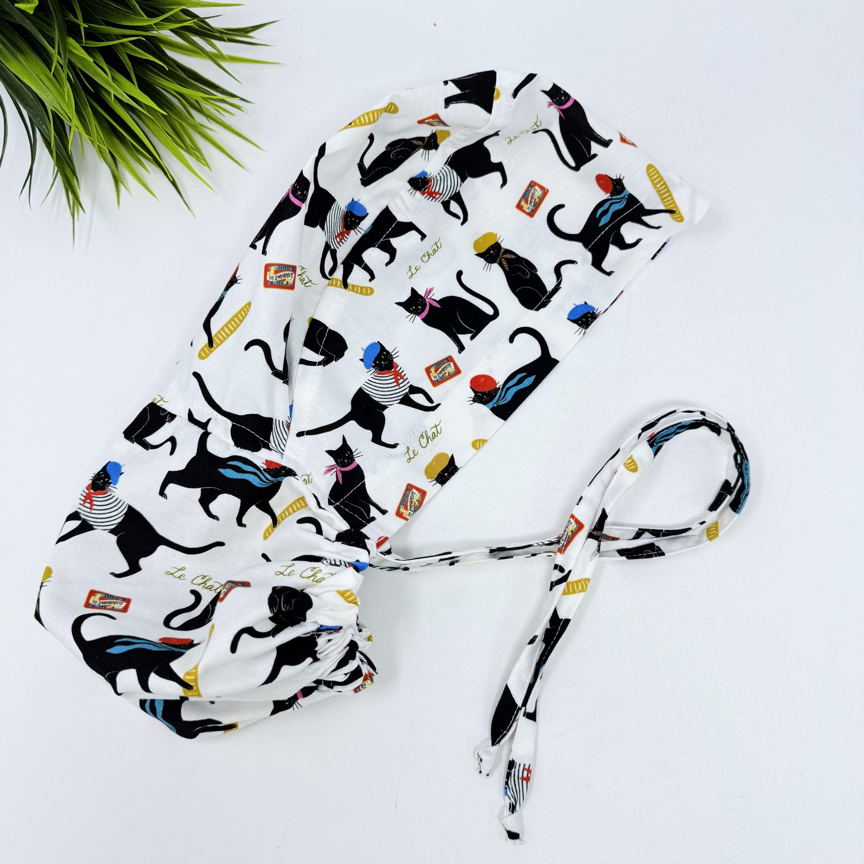 Ponytail scrub cap by Paradise Caps. Parisian Cat Surgical hat for women with satin lined option.