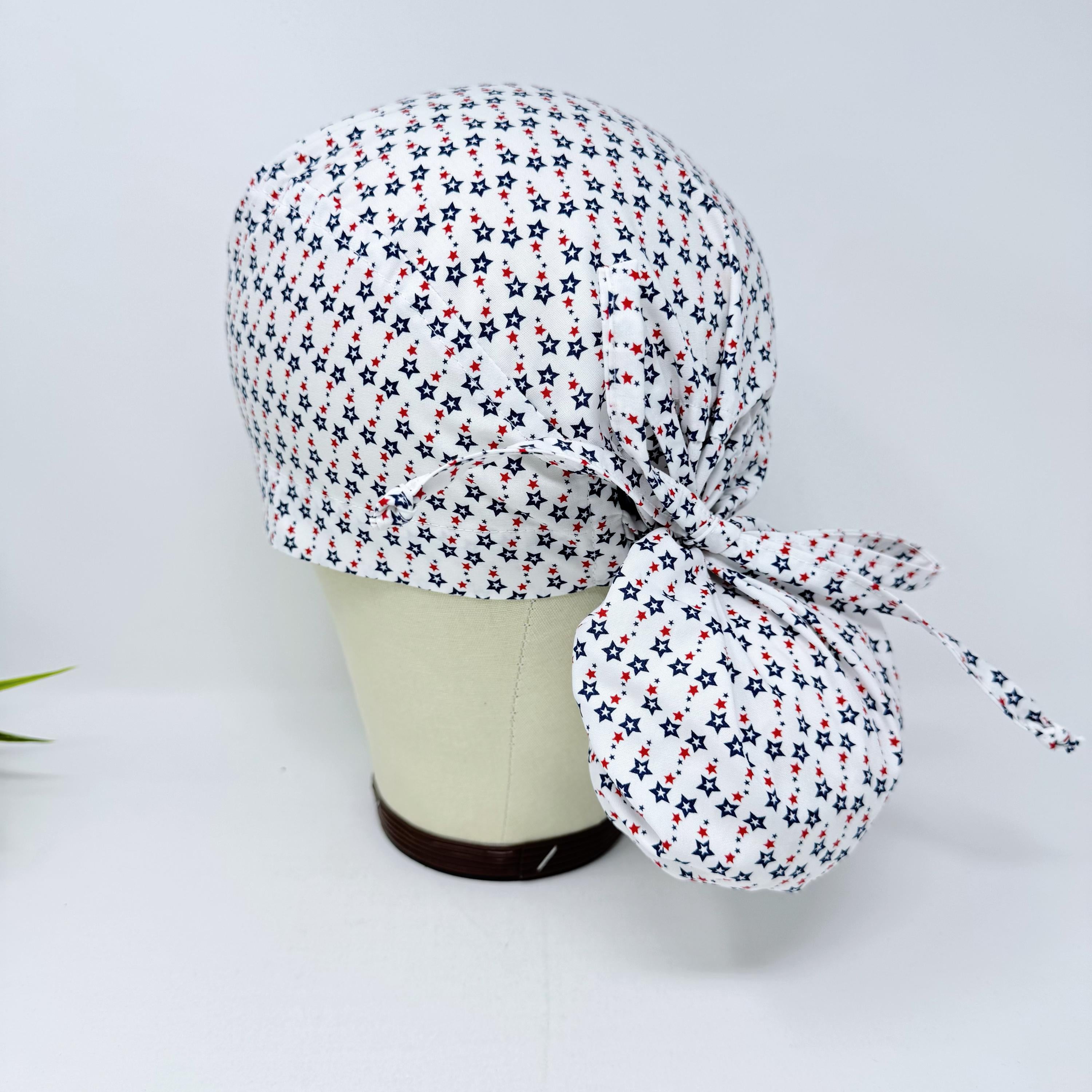 Ponytail scrub cap for women with satin lined option. Patriotic Stars Surgical hat with ponytail by Paradise Caps.