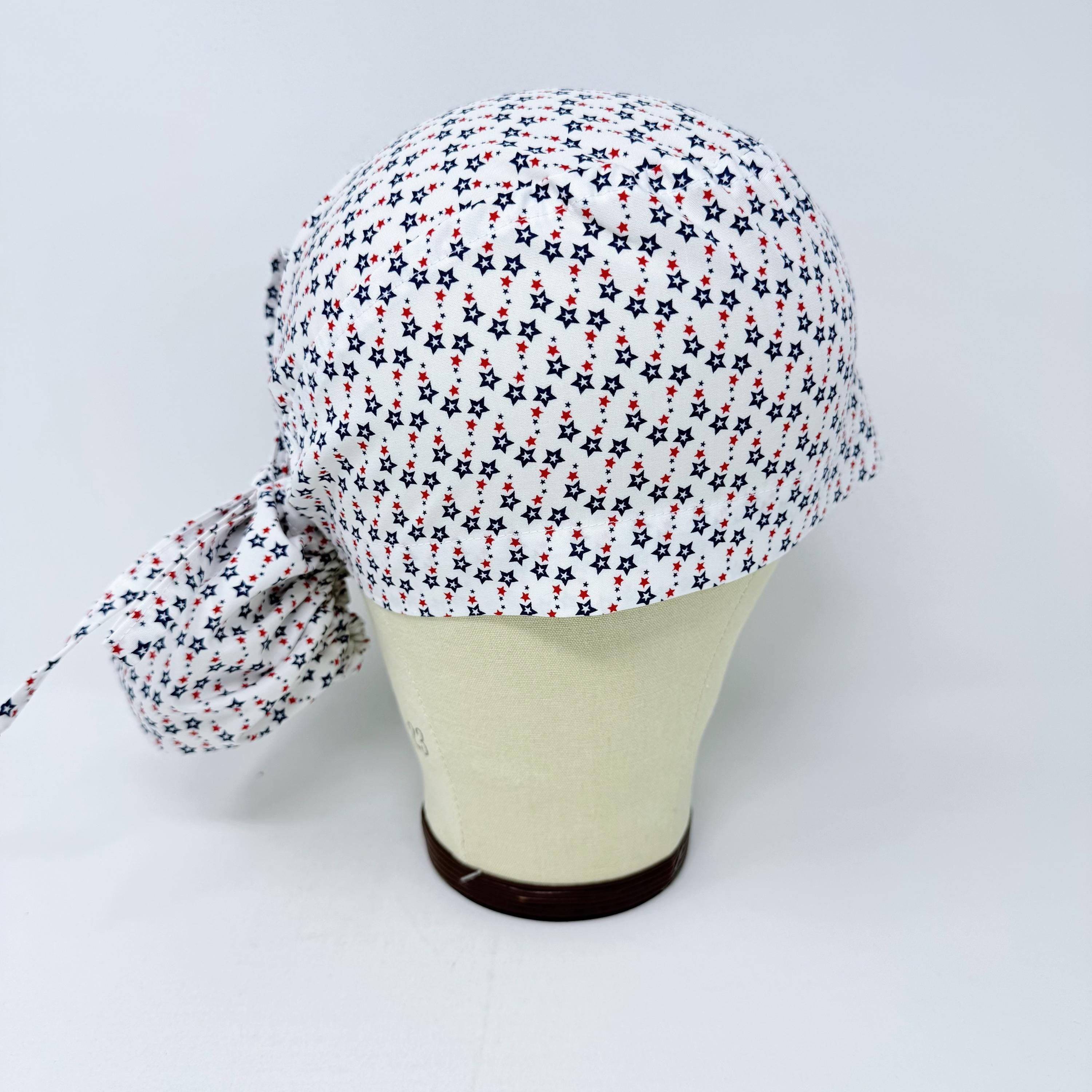 Ponytail scrub cap for women with satin lined option. Patriotic Stars Surgical hat with ponytail by Paradise Caps.