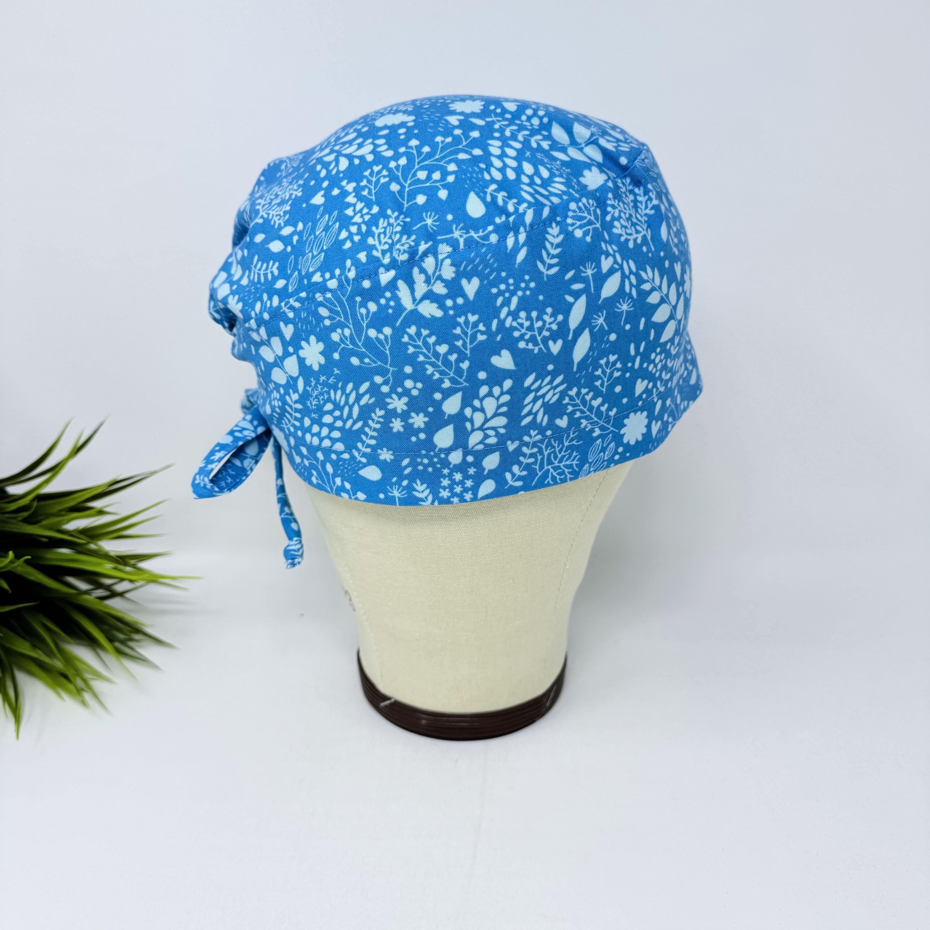Calm Blue Floral Skull tie-back style surgical scrub cap by Paradise Caps.