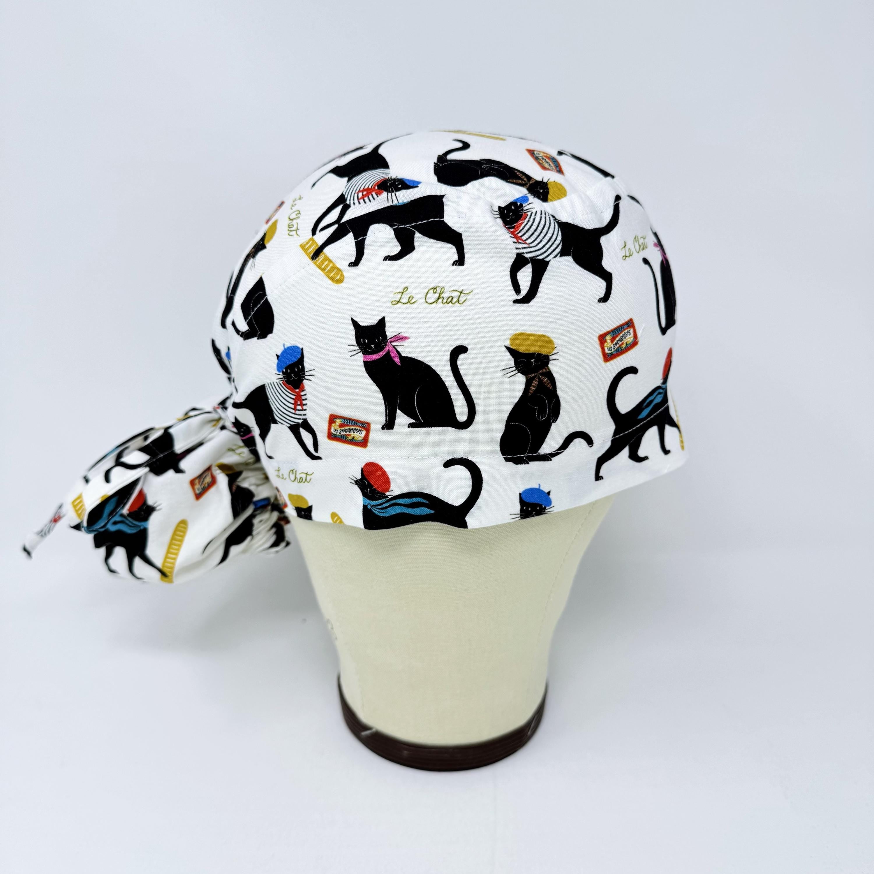 Ponytail scrub cap by Paradise Caps. Parisian Cat Surgical hat for women with satin lined option.
