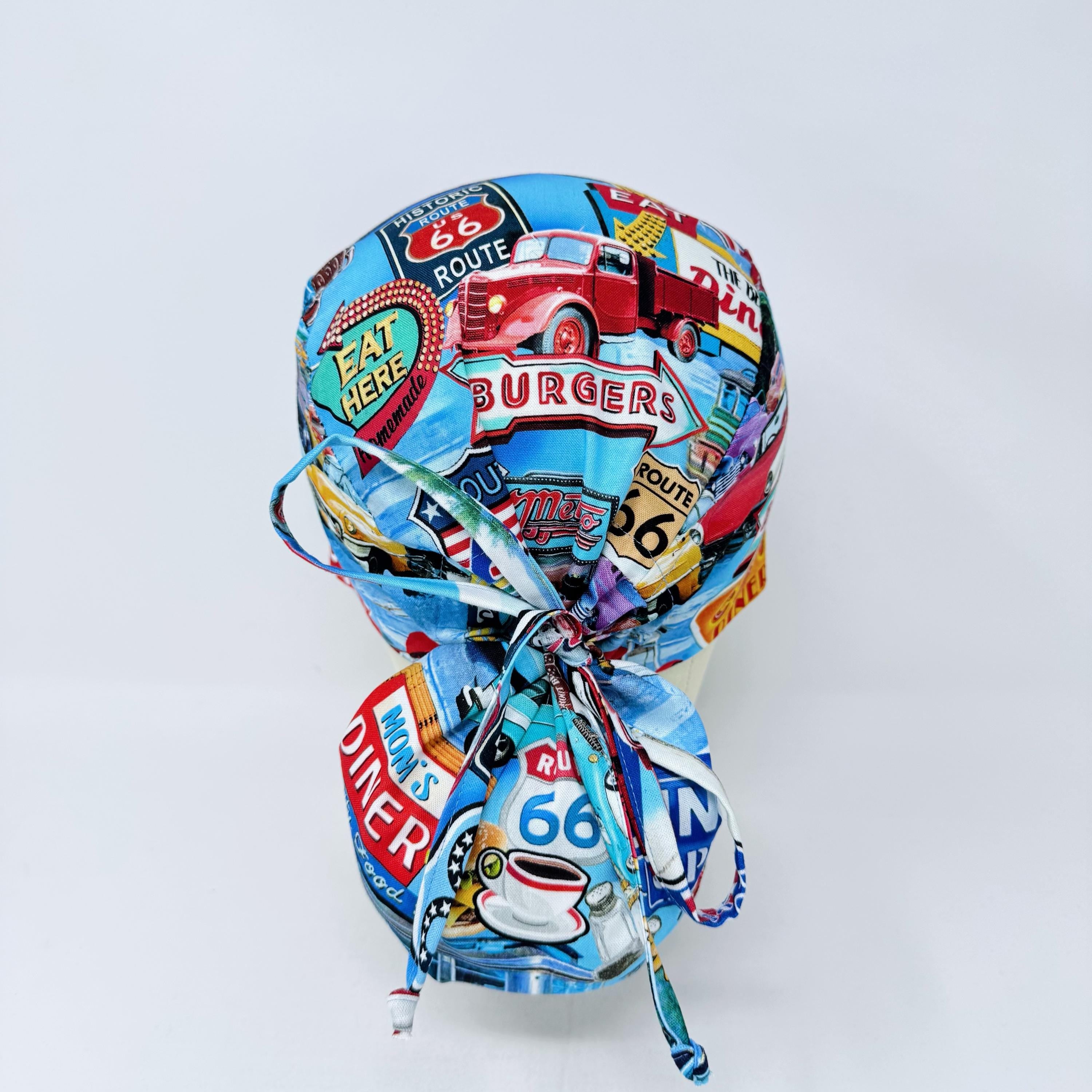 Ponytail scrub cap for women. Route 66 Retro Diner Satin Lined option Surgical hat with ponytail by Paradise Caps.