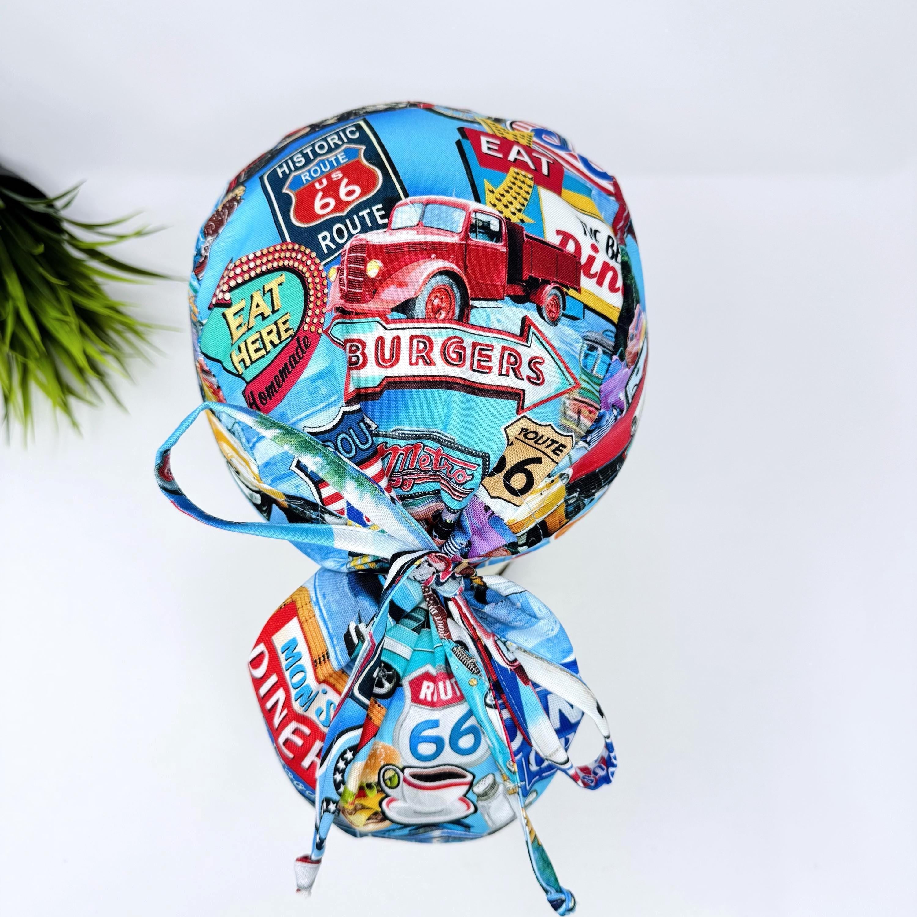 Ponytail scrub cap for women. Route 66 Retro Diner Satin Lined option Surgical hat with ponytail by Paradise Caps.