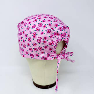 Pink Floral Skull tie-back style surgical scrub cap by Paradise Caps.