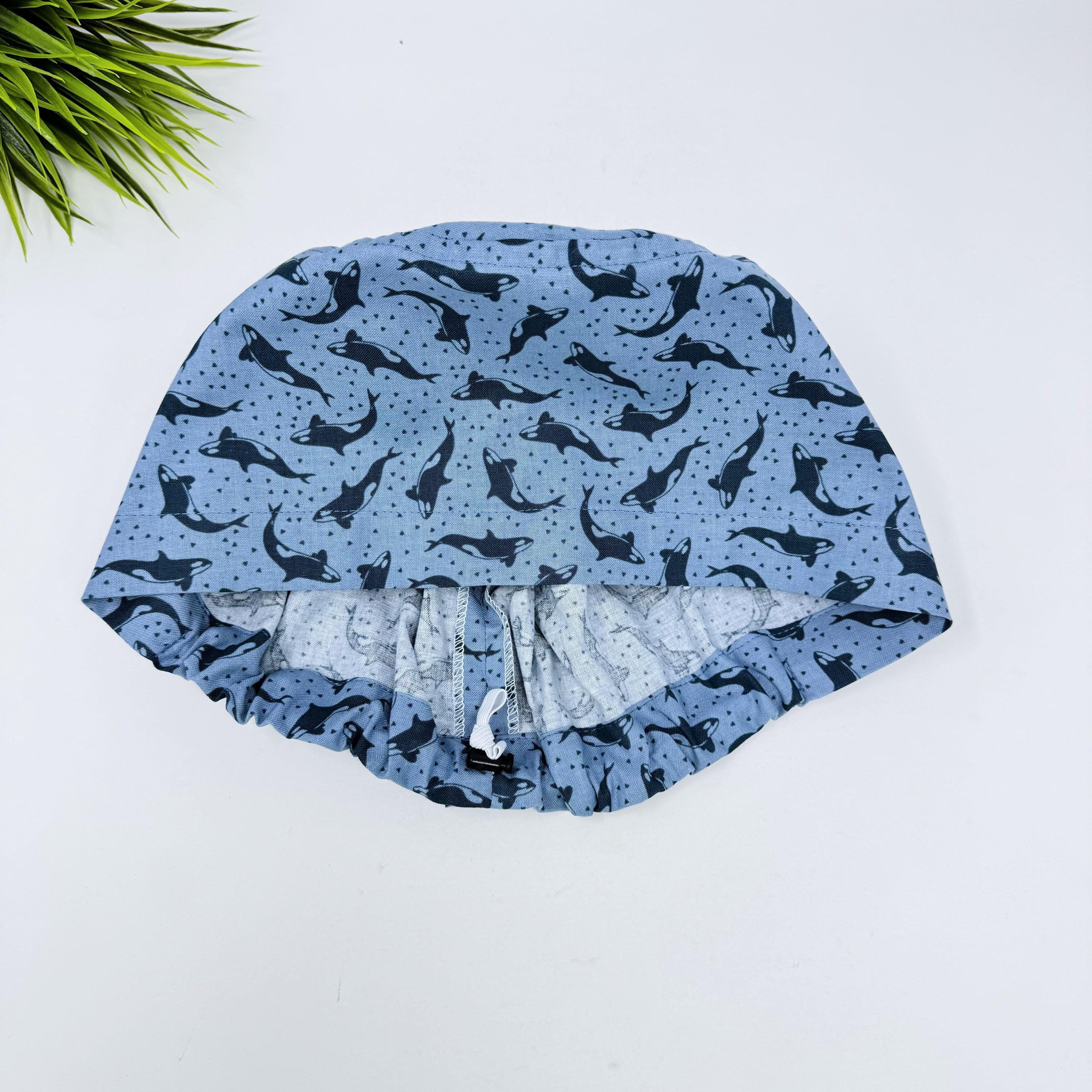 Ocean Orcas Euro scrub cap for women. Blue Sea surgical hap with satin lined option by Paradise Caps.