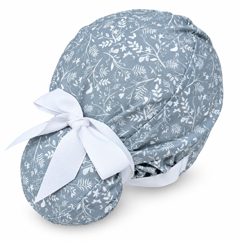 Gray Floral Euro scrub cap with ribbon ties for Women with Satin Lined option by Paradise Caps. Euro PLUS style. on white background with soft shadow
