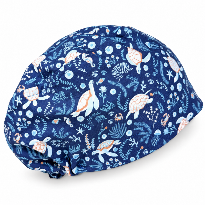 Ocean Turtles Euro scrub cap for women with satin lined option by Paradise Caps. on white background with soft shadow