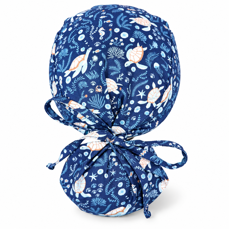 Ocean Turtles Ponytail scrub cap for women with satin lined option by Paradise Caps. on white background with soft shadow