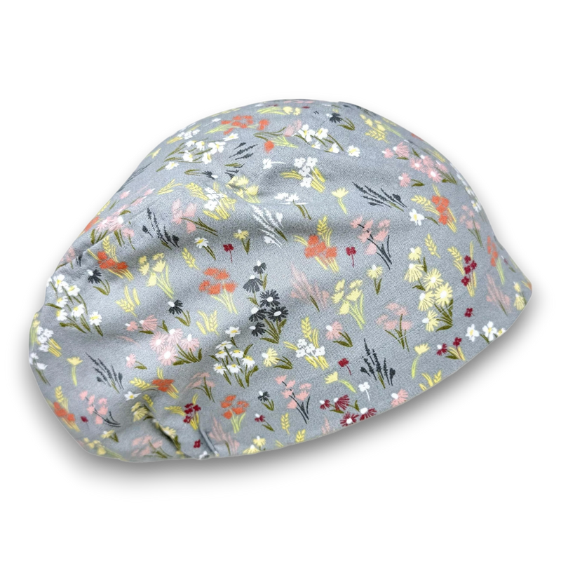 Paradise Caps grey Euro scrub cap with a floral pattern. 100% cotton with adjustable toggle.