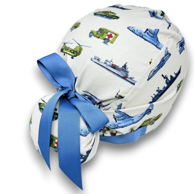 Paradise Caps white Euro scrub cap with military aircraft print and blue ribbon ties. 100% cotton.