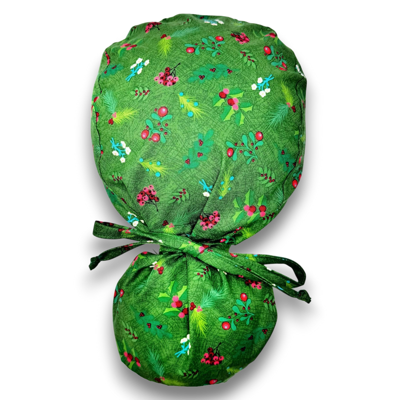 Paradise Caps green cotton ponytail scrub cap with mistletoe and holly print, tie closure, for women.