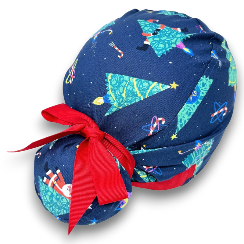 Paradise Caps navy blue Euro scrub cap with Christmas trees, Santa, and candy canes. Features a red ribbon tie closure.