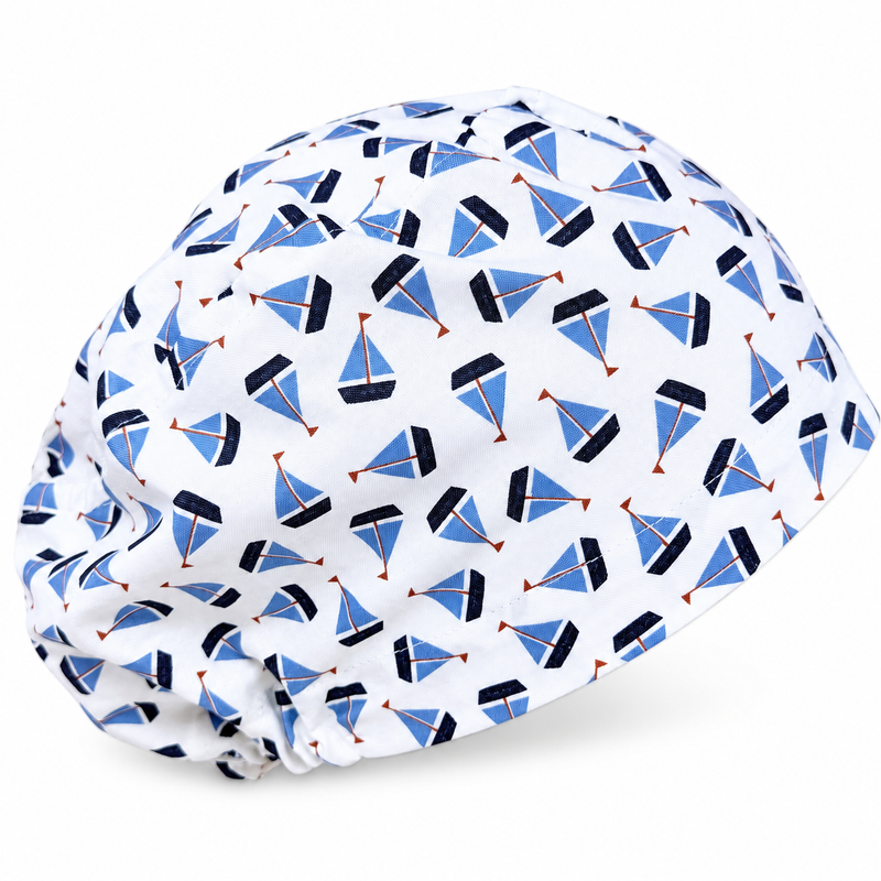 Sailboats Euro scrub cap for women with satin lined option by Paradise Caps. on white background with soft shadow