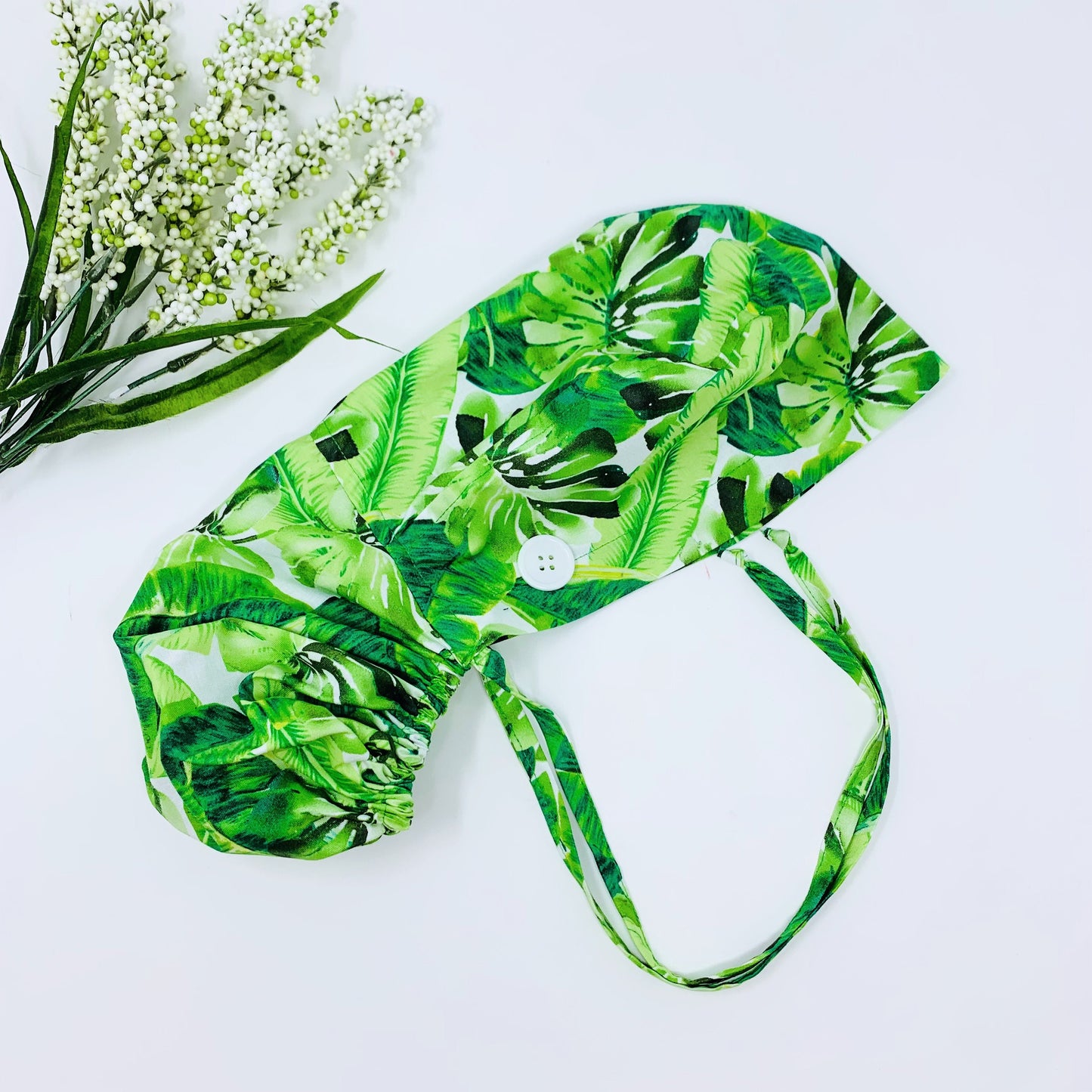 Monstera ponytail scrub cap,  Scrub cap with ponytail holder.