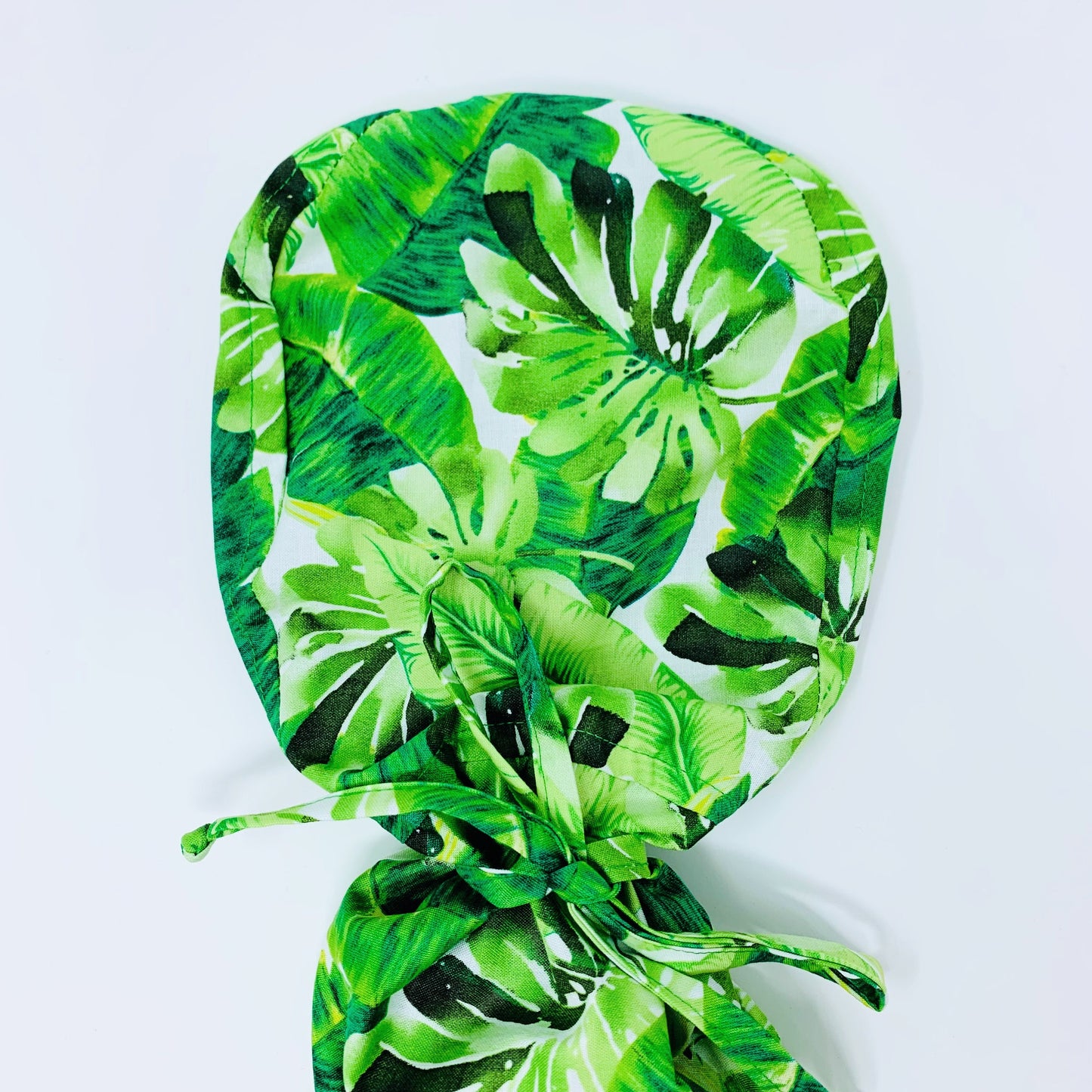 Monstera ponytail scrub cap,  Scrub cap with ponytail holder.