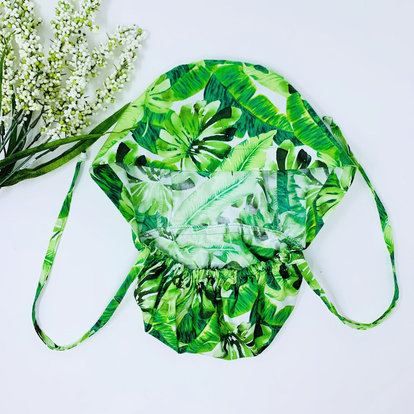 Monstera ponytail scrub cap,  Scrub cap with ponytail holder.