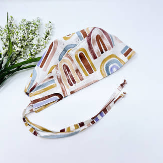 Rainbow Skull tie-back style surgical scrub cap for men by Paradise Caps.