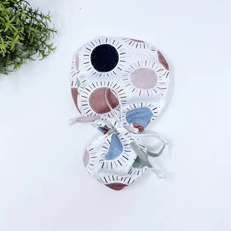 Navy & Coral Suns Ponytail scrub cap for women with satin lined option by Paradise Caps.