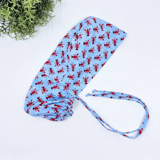 Lobster Ponytail scrub cap for women with satin lined option by Paradise Caps.