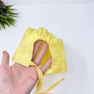 Solid yellow Skull tie-back style surgical scrub cap by Paradise Caps.